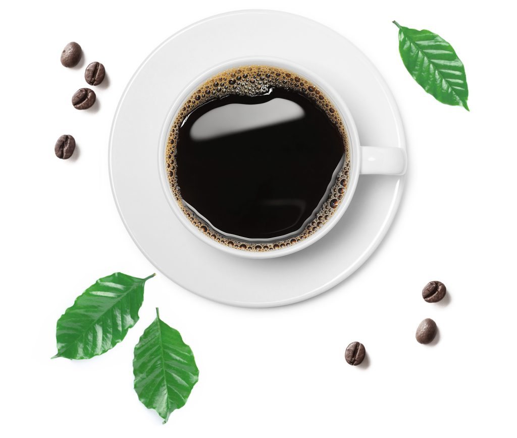 A top-down cup of black coffee with coffee beans and leaves